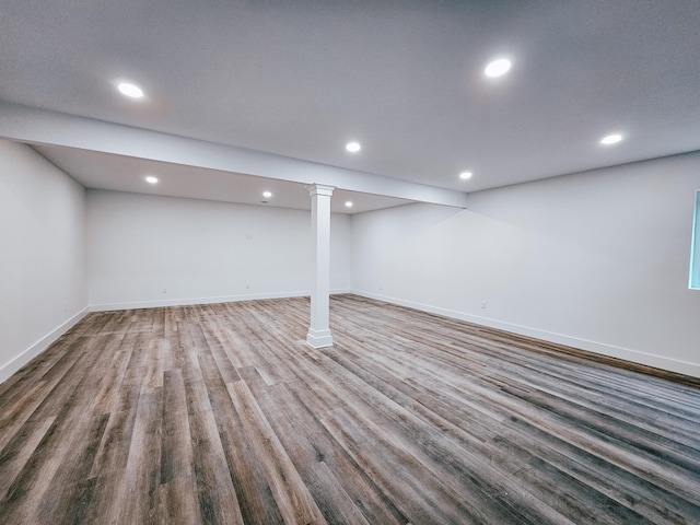 basement with hardwood / wood-style floors