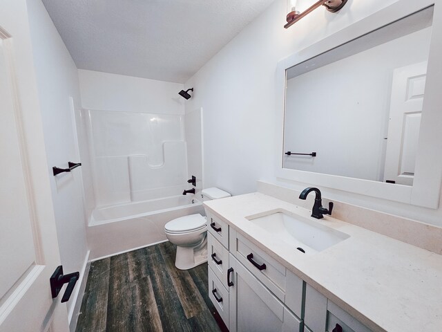 full bathroom with shower / bath combination, hardwood / wood-style flooring, vanity, and toilet