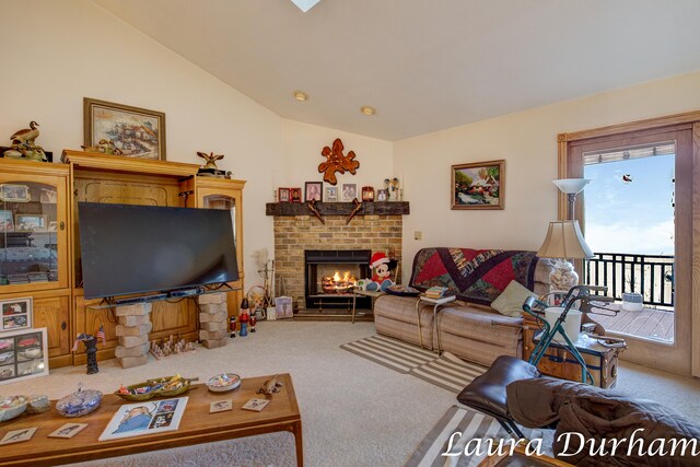 living room with carpet flooring, a fireplace, and vaulted ceiling