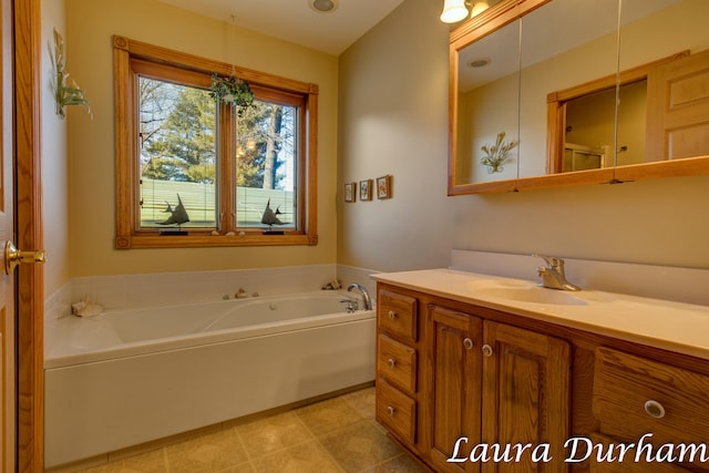 bathroom with vanity and a bathtub