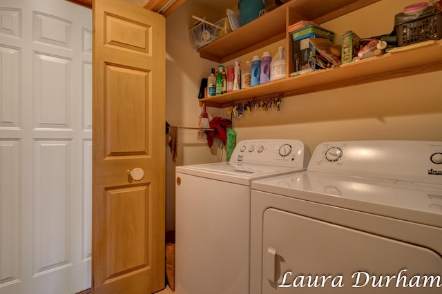 clothes washing area with washer and clothes dryer