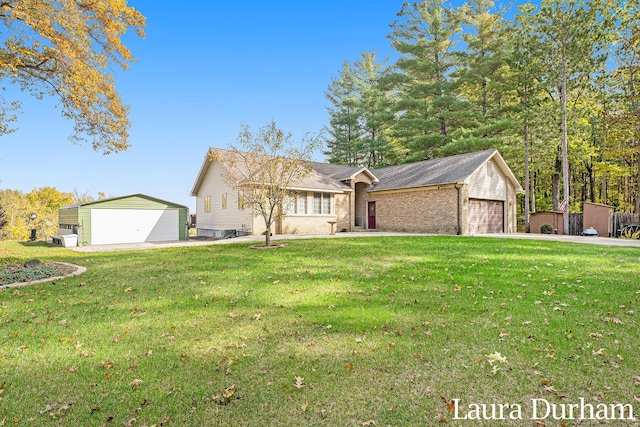 ranch-style home with a garage and a front yard