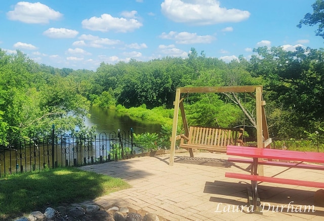 view of patio with a water view