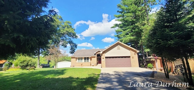 view of front of property featuring a garage and a front lawn