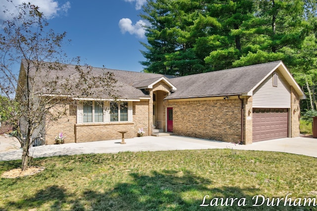 single story home featuring a garage and a front yard