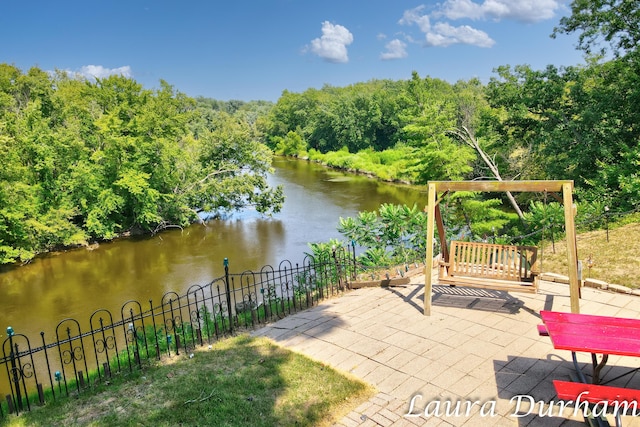 view of patio / terrace with a water view