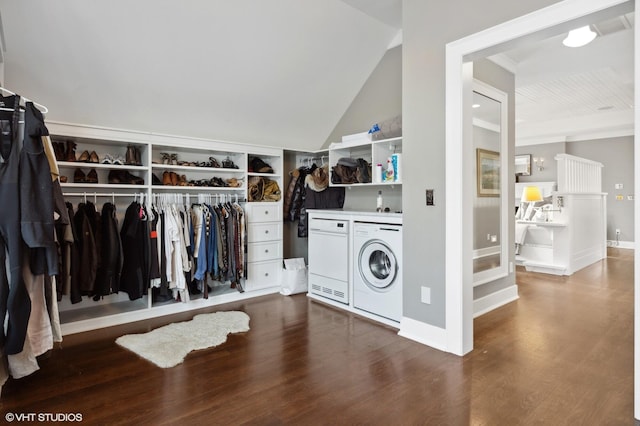 interior space featuring washing machine and clothes dryer and wood-type flooring