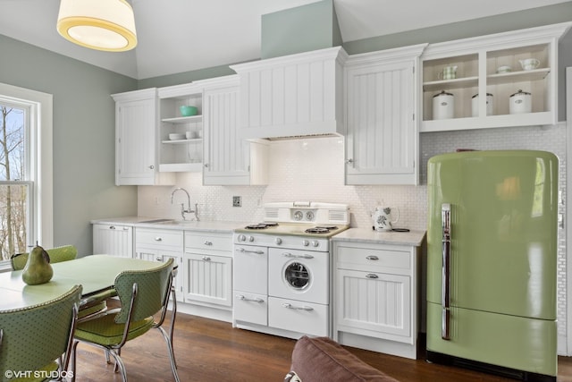 kitchen featuring dark hardwood / wood-style flooring, tasteful backsplash, white cabinets, sink, and white appliances