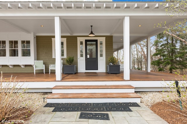 entrance to property featuring covered porch