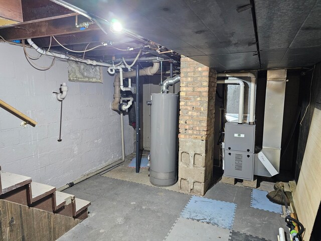basement with water heater and brick wall