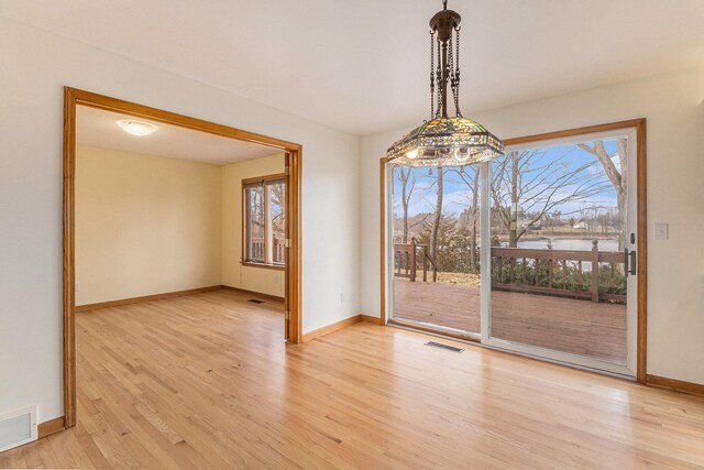 spare room with light wood-type flooring