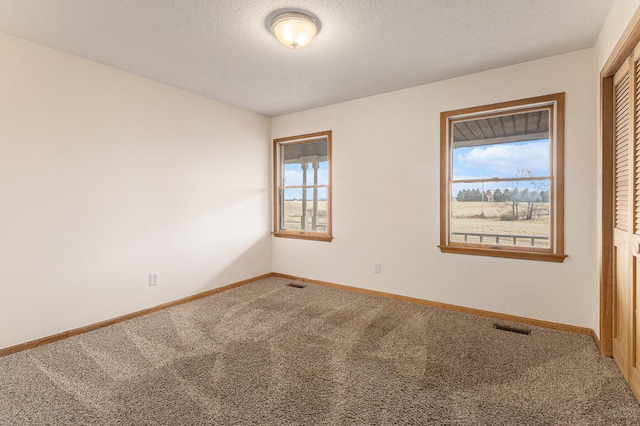 spare room with carpet floors