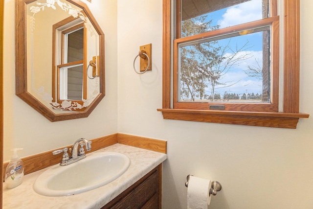 bathroom with a healthy amount of sunlight and vanity