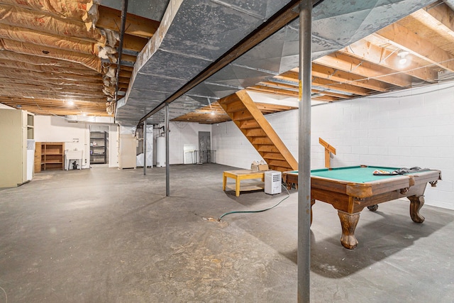 basement with water heater and pool table