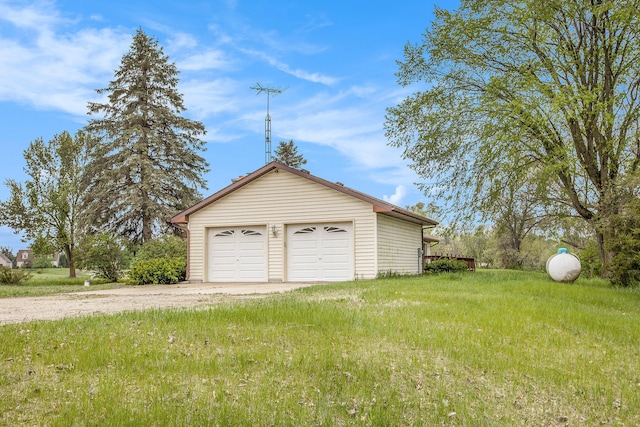 garage with a lawn