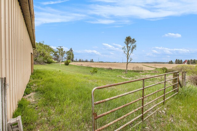 view of yard with a rural view