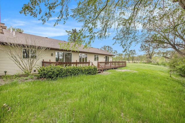 view of yard with a wooden deck