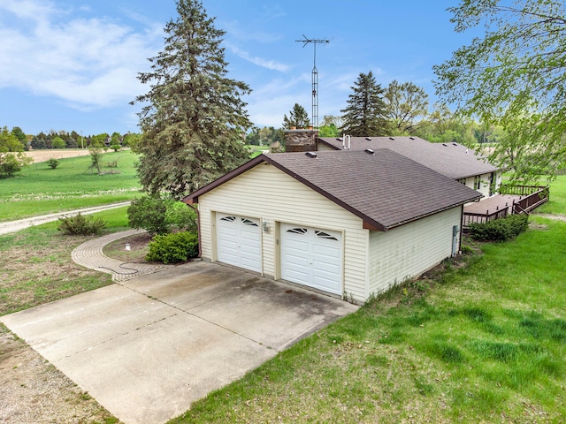 garage featuring a yard