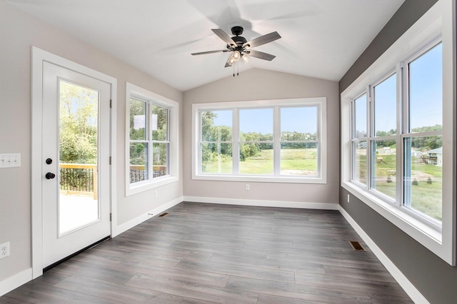 unfurnished sunroom featuring lofted ceiling, a wealth of natural light, and ceiling fan