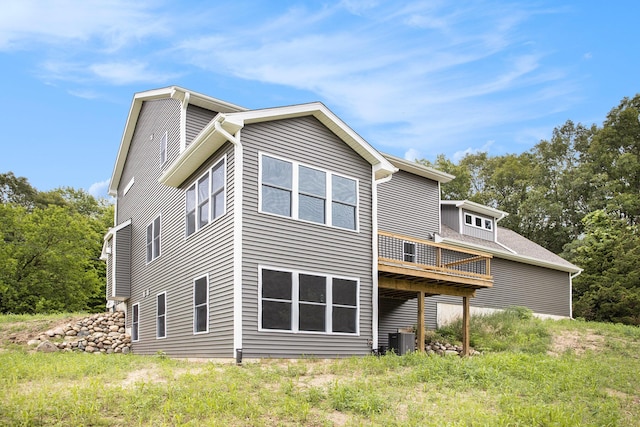 back of house featuring central AC unit