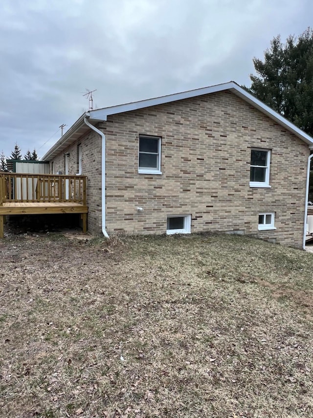 view of property exterior with a wooden deck