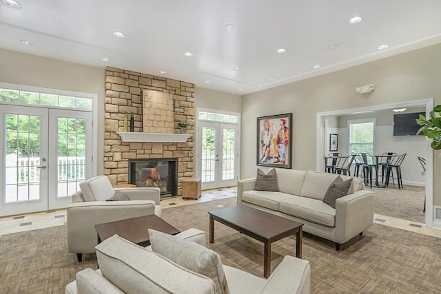 living room with french doors and a fireplace