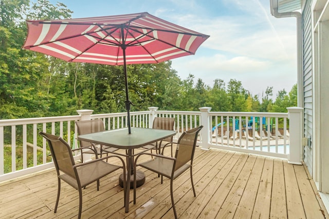 wooden terrace featuring a pool