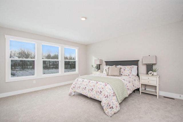 bedroom with light colored carpet