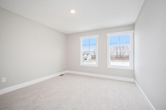 unfurnished room with carpet floors