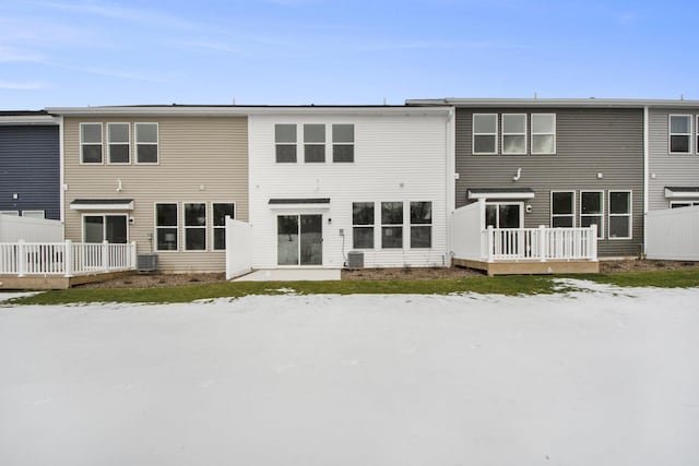 back of property with a wooden deck