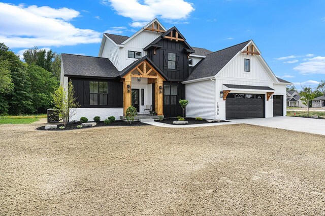 modern inspired farmhouse with a garage