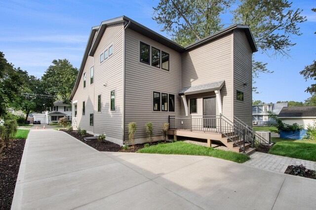 back of house featuring central AC