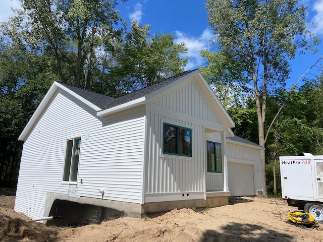 view of side of property featuring a garage