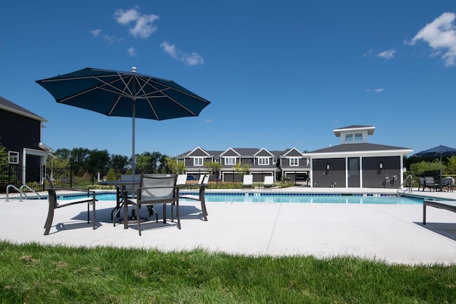 view of swimming pool with a patio area