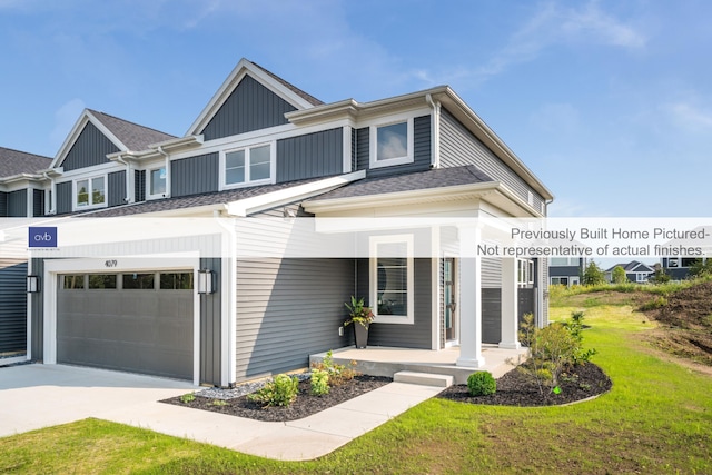 view of front of house featuring a garage and a front lawn