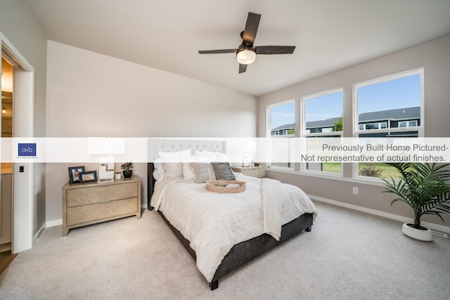 bedroom with ceiling fan and light colored carpet