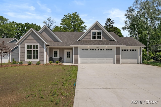 view of front facade with a front yard and a garage