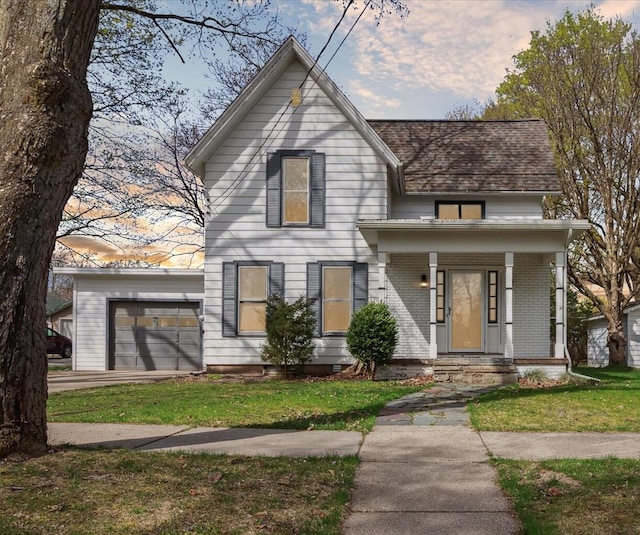 view of front facade with a garage, a porch, and a lawn