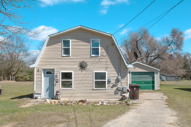 view of front facade with a front yard and a garage