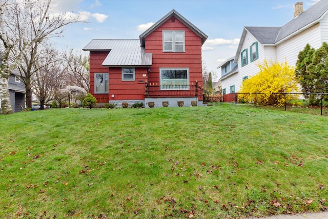 back of house featuring a yard