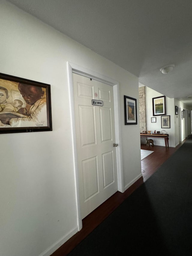 corridor featuring hardwood / wood-style floors