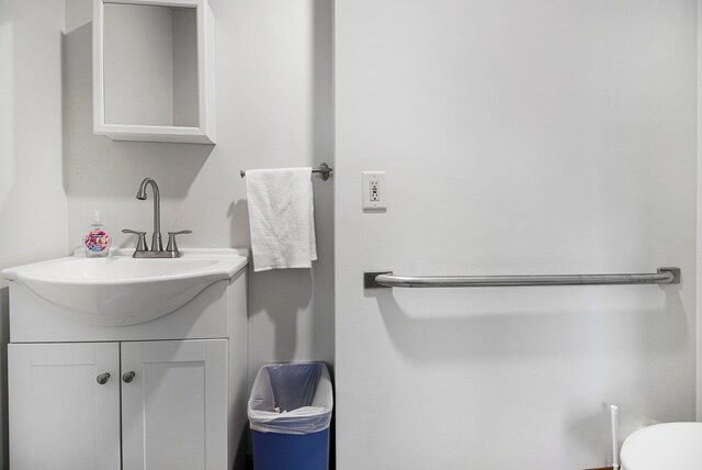 bathroom featuring toilet and vanity