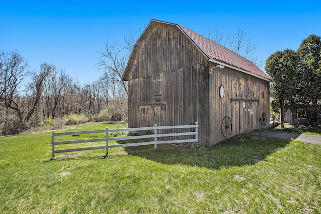 view of outbuilding with a lawn