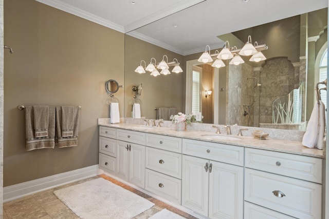 bathroom with vanity, crown molding, and tiled shower