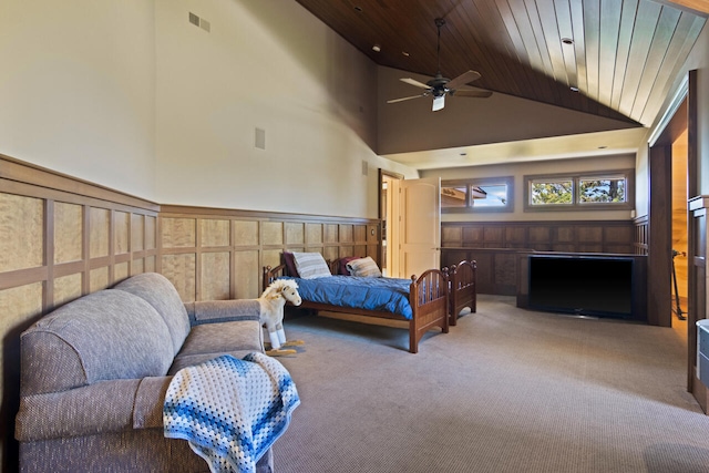 bedroom featuring ceiling fan, carpet, high vaulted ceiling, and wood ceiling