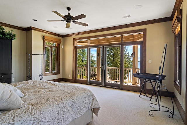 carpeted bedroom with crown molding, access to exterior, and ceiling fan