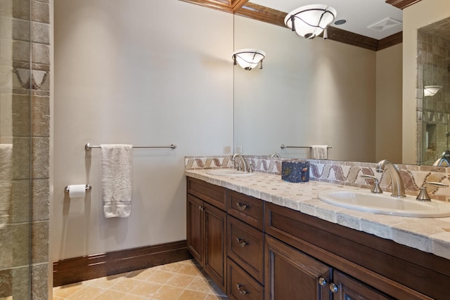 bathroom with vanity, ornamental molding, and a shower with door