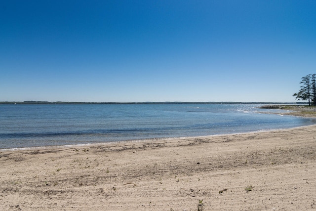 property view of water featuring a beach view