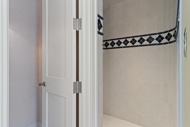 bathroom with a tile shower