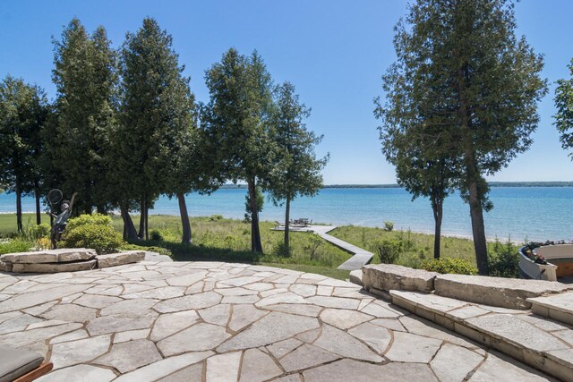 view of patio with a water view